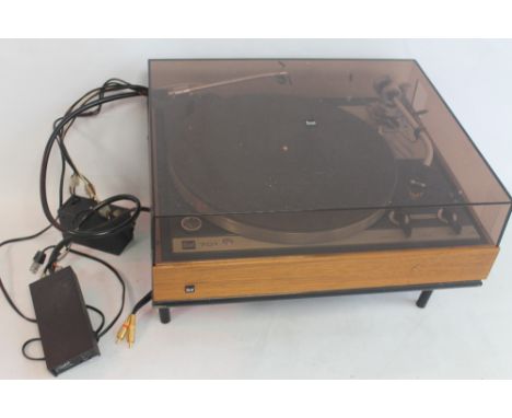 A DUEL 701 CS TURNTABLE RECORD PLAYER on metal stand