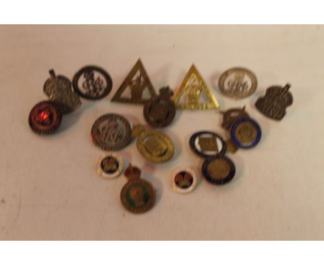 THREE WWI BADGES, six "On War Service" badges (1914/15/16), two HM silver A.R.P. brooches, a Womens' Land Army badge, a Chesh