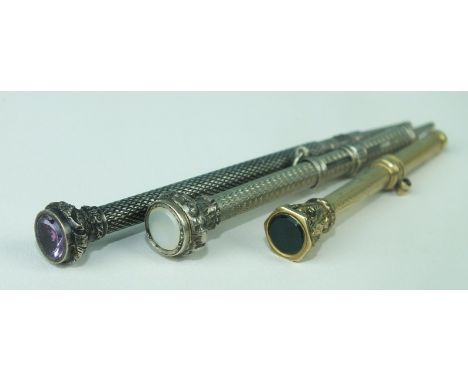 A French gold miniature propelling pencil and two similar white metal pencils, (3).