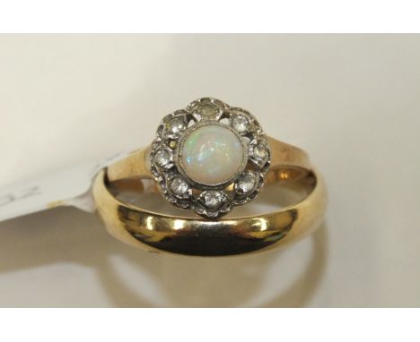 A 9ct gold ring set opal and white stone cluster, size O, 2.6g and a 9ct gold wedding band, size U, 3.9g, (2).