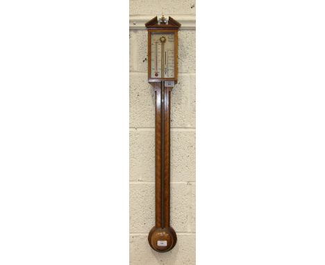 A reproduction Georgian-style stick barometer, the inlaid mahogany case with silvered dial and scales, signed 'Comitti, Holbo