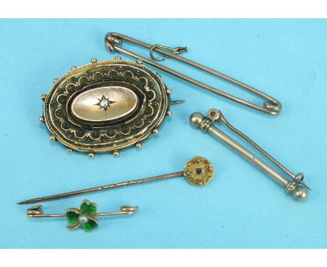 A 15ct gold brooch set diamond, (a/f), three other brooches and a stick pin, total weight 13.5g.