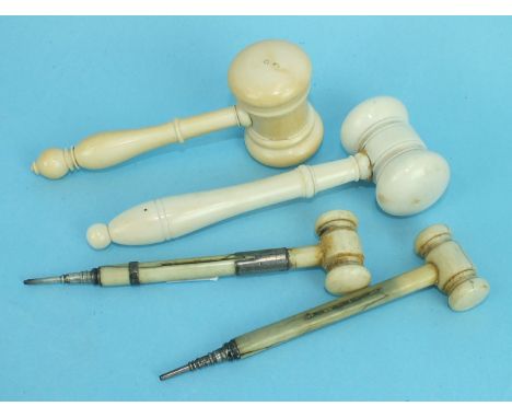 Two novelty ivory propelling pencil auctioneers gavels, (both af), 12cm extended and two ivory gavels, (both af), (4)