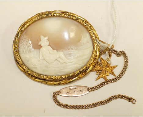 An oval shell cameo in gilt metal mount, a small yellow metal stick pin with pendant Maltese cross and a 9ct gold identity br