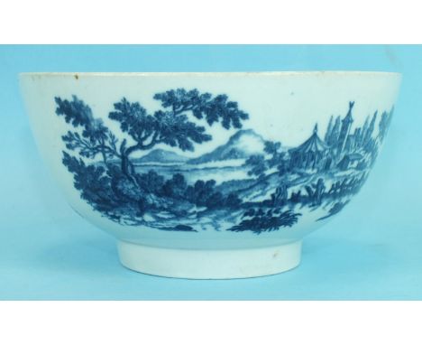An 18th century Worcester porcelain bowl printed in blue with country scenes, crescent mark to base, 16cm diameter.