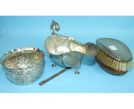 A Victorian embossed circular bowl, Birmingham 1898, a late-Victorian sauce boat, (a/f) and a pair of engine-turned silver-ba