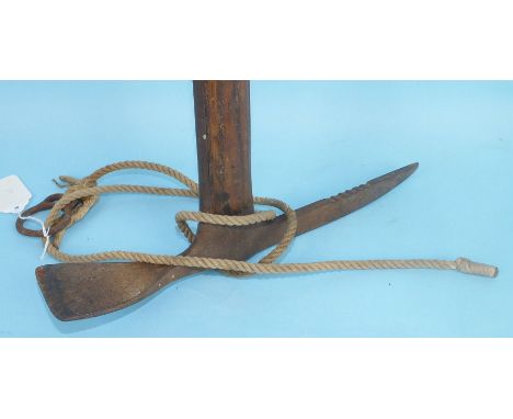An early-20th century climber's hickory-shafted iron ice axe, 83cm long.