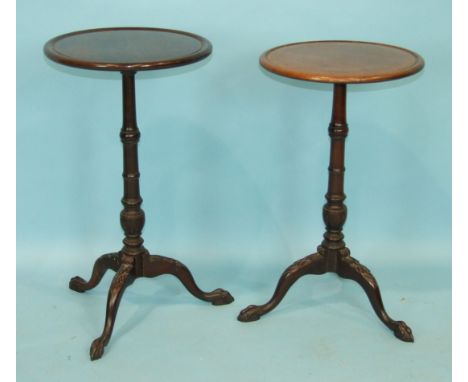 Two Georgian-style mahogany wine tables, each on turned column and carved tripod with claw and ball feet, 36cm diameter, 64cm