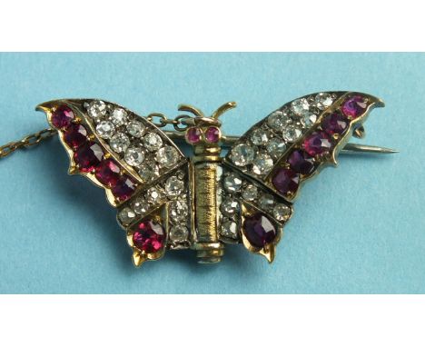 A ruby and diamond butterfly brooch, the wings set old brilliant-cut diamonds and round-cut rubies, in unmarked gold mount, 3