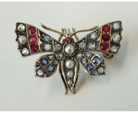 A Victorian gem-set butterfly brooch, the wings set rose-cut diamond and round-cut sapphires and rubies, the body set pearls 