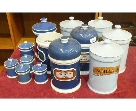 A collection of sixteen ceramic drug jars and covers, some with gilt transfer labels, 26cm - 11cm high, (many damaged), (16).