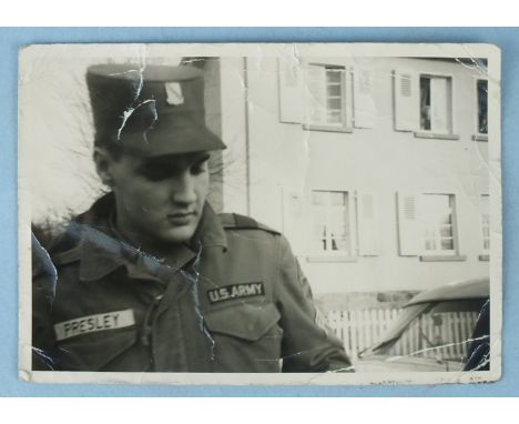 A signed Elvis Presley photograph, c1958/59, pen signature on the back of a photograph of Presley in US Army uniform, 7.3 x 1