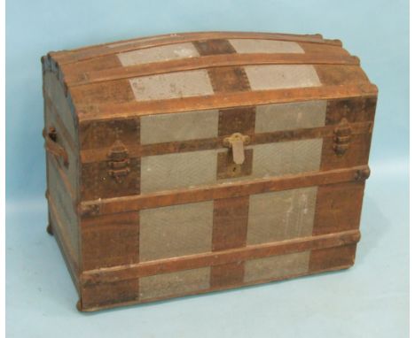 A 19th century metal and wood-bound travelling trunk, the domed lid opening to reveal a fully-fitted interior, including lidd