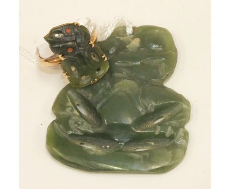 A Maori jade Tiki figure mounted as a ring, in 9ct gold mount and a Maori jade Tiki pendant, 4.5cm long.