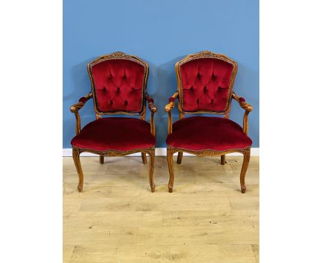 Pair of French style button back upholstered elbow chairs with carved front legs, 59 x 56 x 89cms. Estimate £30-50