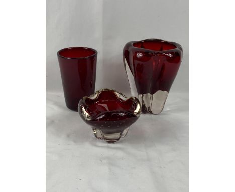 Three Whitefriars ruby coloured glass vases, tallest 18cms. Estimate £20-40.