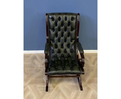 Mahogany framed green leather button back rocking chair with studded decoration throughout, 60 x 87 x 96cms. Estimate £80-120