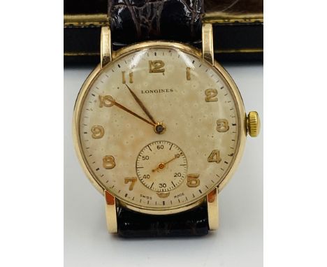 Gentlemans Longines 17 jewel manual wind wristwatch, with subsidiary seconds dial, in 9ct gold case, on leather strap, in box