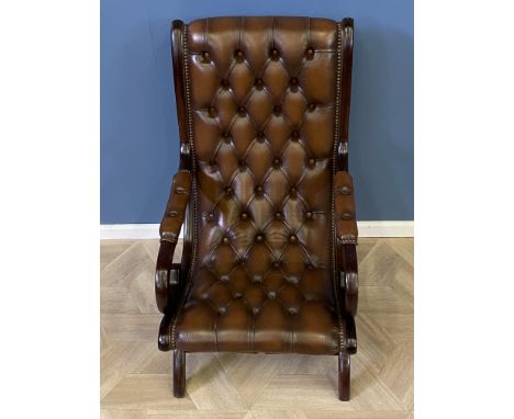 Mahogany framed leather button back armchair with studded decoration throughout, 59 x 70 x 99cms. Estimate £90-140.
