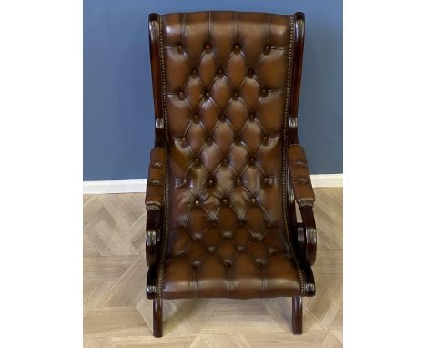 Mahogany framed leather button back armchair with studded decoration throughout, 59 x 70 x 99cms. Estimate £100-140.