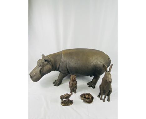 Large decorative resin hippo, 90 x 40cms; together with a resin hare, 34cms, two other resin figures and a ceramic bear. Esti