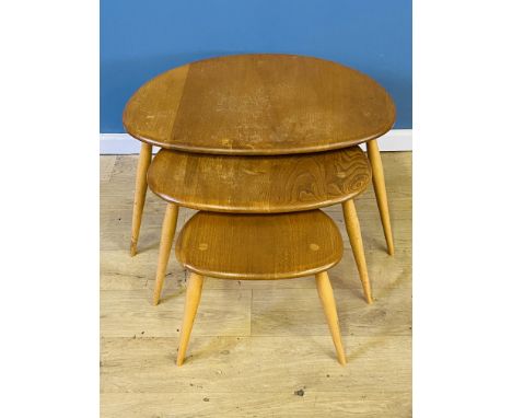 Ercol nest of three pebble tables, Ercol label to underside, 65 x 44 x 40cms (largest table). Estimate £150-200