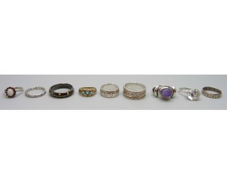 Eight silver rings, 41g, and a plated ring
