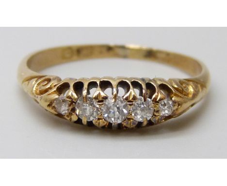 An 18ct gold five stone diamond ring, 2.6g, O/P
