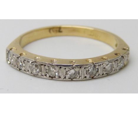An 18ct gold, nine stone diamond half eternity ring, 2.6g, K