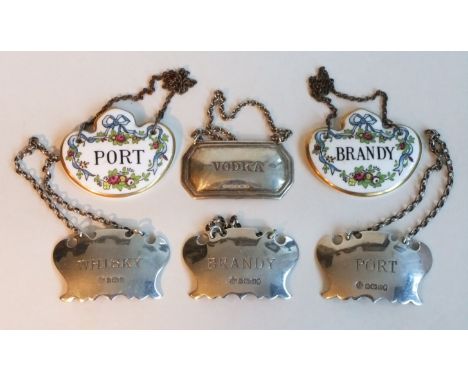 A collection of Silver hallmarked decanter labels together with two ceramic labels , port , whisky and brandy. H3-4cm W5.5cm