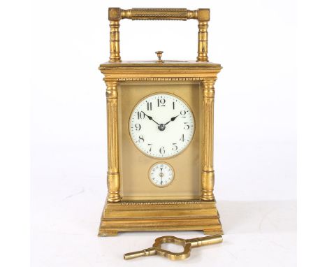 An Early 20th century repeating carridge clock, the case of architectural form having a stepped cornice above reeded columns 