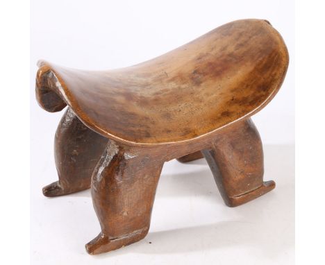 A Sudan Bongo Zoomorphic Headrest, southern Sudan, 32cm long 19cm high.  *CR  general marks and wear, chip to head/tail.