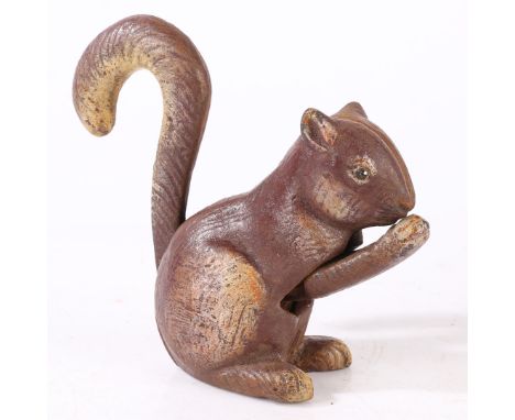 A 20th century novelty cast metal nut cracker, in the form of a squirrel, 14cm high.  *CR  general marks, some losses to pain