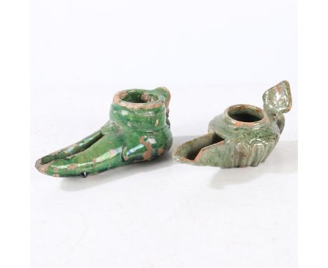 The first with a palmette-shaped thumb-piece and loop handle and long spout, the second with a pierced bowl above the long sp