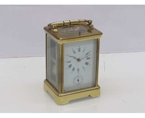 A 20th Century L'Epee brass cased carriage clock with alarm, strike and repeating mechanisms, Roman enamelled dial, with key,