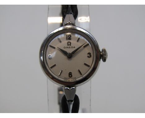 OMEGA: An early to mid 20th Century steel cased ladies manual wind wristwatch with boot lace strap 