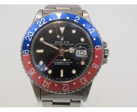 ROLEX: an Oyster Perpetual Date GMT-Master gent's stainless steel bracelet watch, 'Transitional' reference 16750, black Swiss