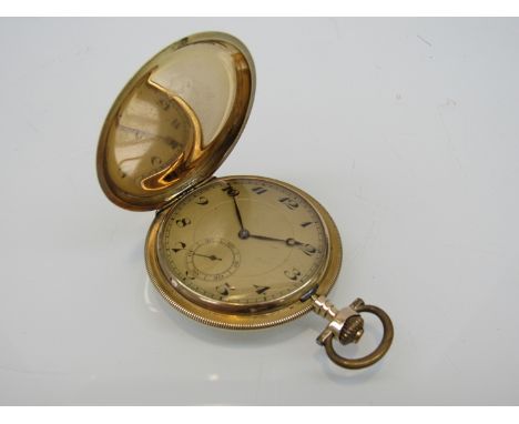 An early 20th Century 14k gold full hunter Swiss pocket watch, unsigned keyless manual wind movement, gilded Arabic dial with