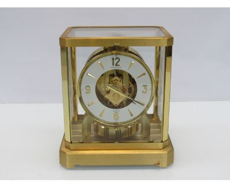A Jaeger LeCoultre Atmos clock in gilt brass and glazed casing, no. 325599, 23.25cm high
