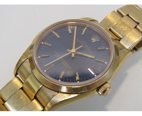 ROLEX; An 18ct gold Oyster Perpetual gents automatic bracelet watch, blue metallic dial with gold baton markers, hands and ce