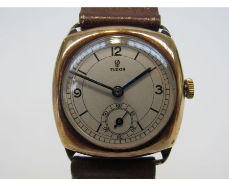 TUDOR: an early to mid 20th Century 9ct gold cushion cased gent's manual wind wristwatch, Arabic silvered dial with subsidiar