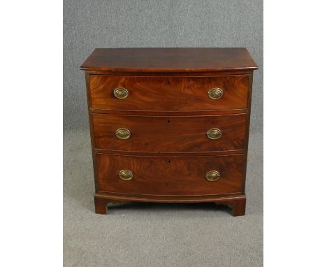 Chest of drawers, Georgian flame mahogany bow fronted on bracket feet. H.90 W.83 D.50cm. 