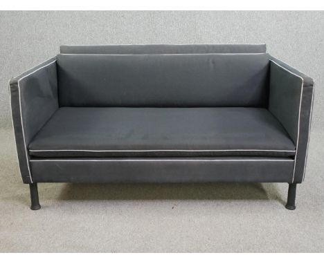 A contemporary Caravane Poppi sofa with matching throw cover. H.65 W.128 D.81cm. 