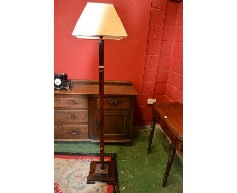 An Art Deco mahogany standard lamp.
