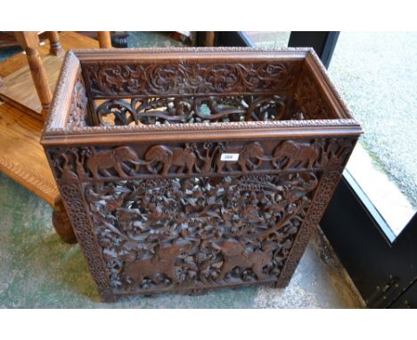 A 19th century Indian hardwood rectangular hall walking stick stand, pierced and carved throughout with elephants, flowers an