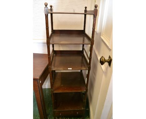 A George IV mahogany five-tier whatnot, sphere finials, rectangular plateaux, ring-turned supports, drawer to base, brass cas