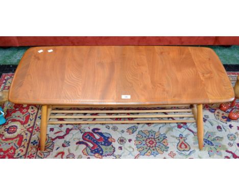 An Ercol coffee table with spindled undertier 