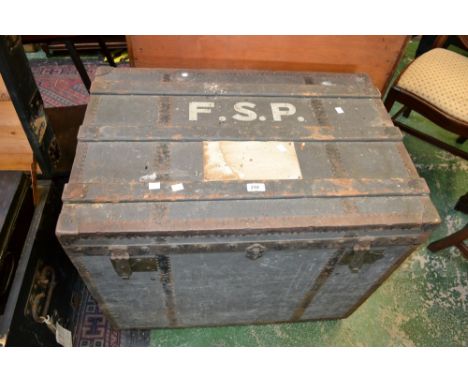 A vintage wood bound travel trunk by J Burton Bros, London.