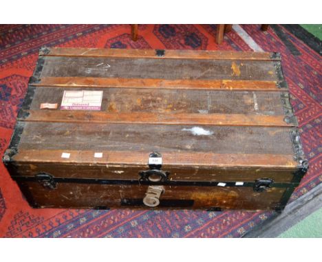 A vintage wood bound travel trunk