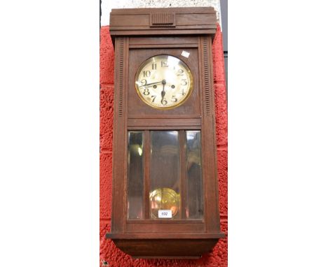 An Art Deco style oak wall clock